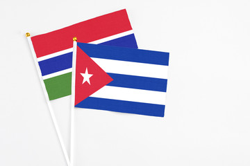 Cuba and Georgia stick flags on white background. High quality fabric, miniature national flag. Peaceful global concept.White floor for copy space.