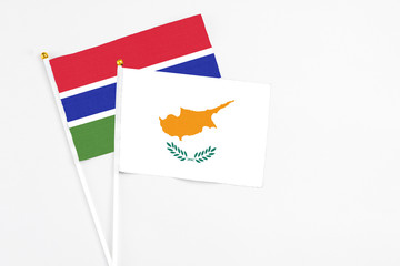 Cyprus and Georgia stick flags on white background. High quality fabric, miniature national flag. Peaceful global concept.White floor for copy space.