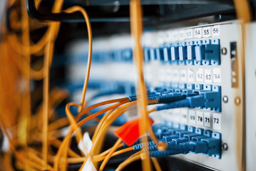 Close up view of internet equipment and cables in the server room