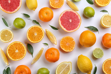 Flat lay composition with tangerines and different citrus fruits on white background