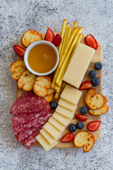 Set of appetizers served on wooden board