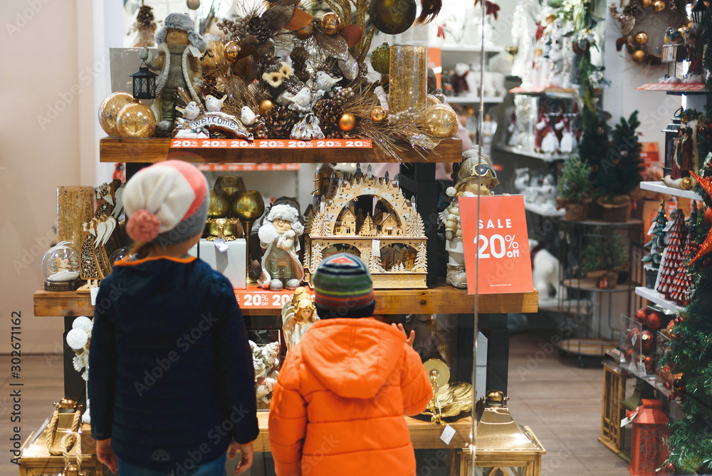 Sticker children looking at christmas presents at shop