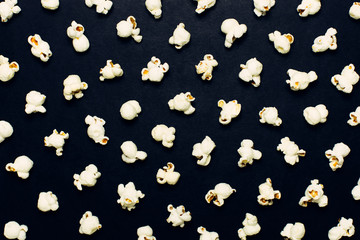 Popcorn on a black background. Creative layout idea