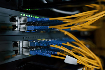 Close up view of internet equipment and cables in the server room