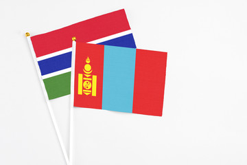 Mongolia and Georgia stick flags on white background. High quality fabric, miniature national flag. Peaceful global concept.White floor for copy space.