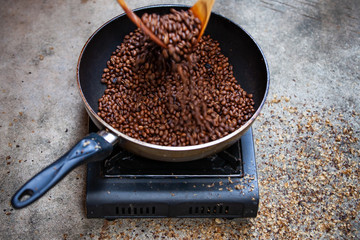 Traditional roasting coffee at home,  freshly roasted coffee beans.