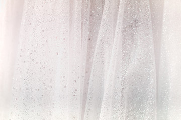 White fabric cotton with shiny glitter background texture.