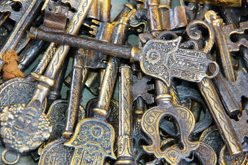 Fototapeta na wymiar vintage ancient rusty metal keys with patterns and crests