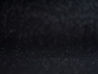 Shiny bokeh abstract background for celebration concept. Dark glitter bokeh lights. defocused.