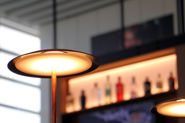 Lighting led Lamp . Alcohol bottles  on the background. Selective focus