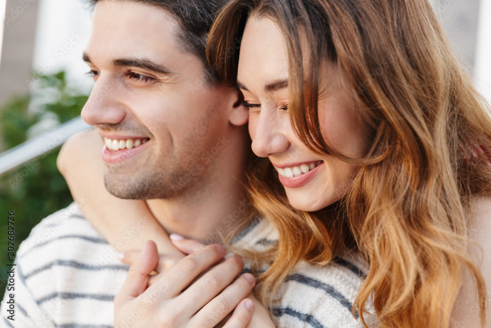 Canvas Prints Image closeup of pleased beautiful couple laughing and hugging