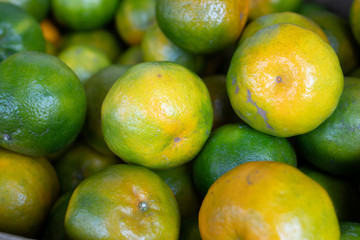 orange fruit stacked on the marketplace at Taiwan