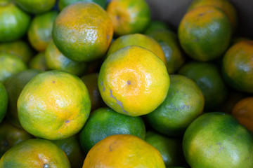 orange fruit stacked on the marketplace at Taiwan
