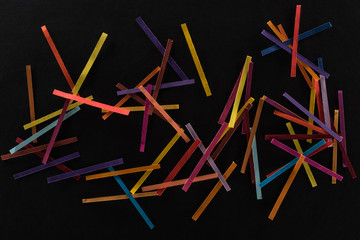 top view of multicolored abstract lines isolated on black background, connection and communication concept