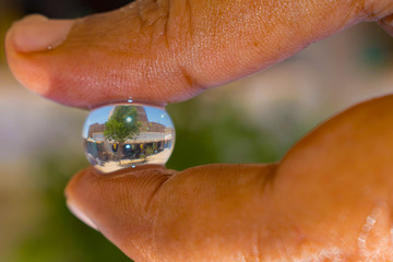 reflection of a house in a hydro gel ball.