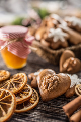 Gingerbread christmas cookies with jar of honey on kitchen table - Close-up