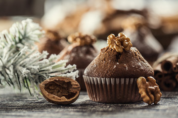 Christmas chocolate delicious muffins sprinklad with sugar powder and wallnut on top
