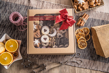 Box full of christmas sweet cokies and pastry with red ribbon - Powered by Adobe