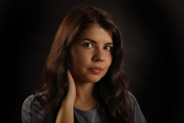 Fototapeta premium Portrait of a cute brunette girl