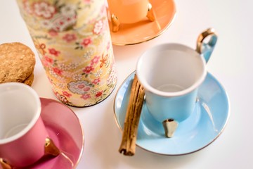 Set of vintage colorful porcelain cups of tea close-up. Infusion, breakfast and morning concept.