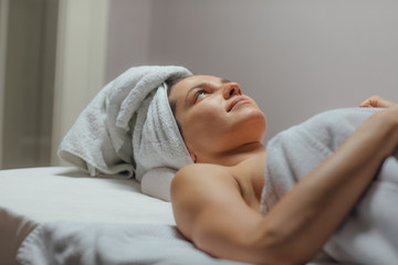Obraz na płótnie Canvas Woman Lying on a Massage Table