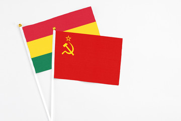 Soviet Union and Ghana stick flags on white background. High quality fabric, miniature national flag. Peaceful global concept.White floor for copy space.