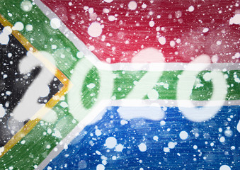 The 2020 New Year lettering is represented by a double exposure against a background of a children's drawing where she drew national flag of  South Africa