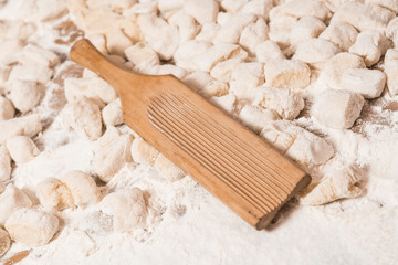Hands kneading dough for gnocchi.