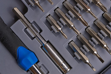 small screwdriver with nozzles in a case