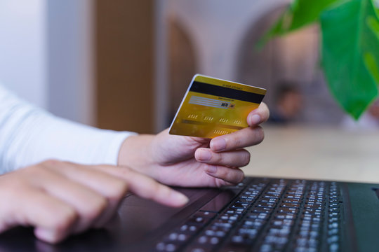 woman holding credit card and use laptop for with shopping online. Online payment concept. - Image