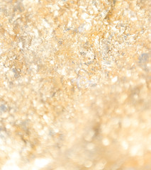gilted gold confetti sparkle close up