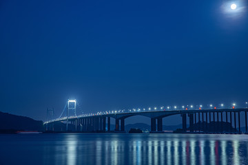 Night view of Humen Bridge on the sea in Zhujiangkou, Guangdong Province, China