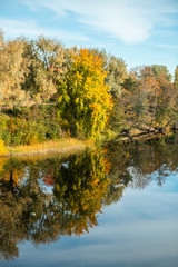 Fototapeta na wymiar Beautiful autumn landscape of Kymijoki river waters in Kuusankoski. Finland, Kymenlaakso, Kouvola