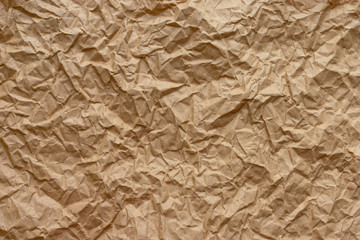 Coarse wrinkled paper. The texture is paper. Brown color.