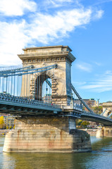 Obraz premium Amazing construction of the Szechenyi Chain Bridge, suspension bridge, over the Danube river in Budapest, Hungary. Tourist landmark in the Hungarian capital city. Historical architecture