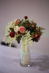 Bouquet flower in a white vase on a light background