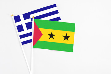 Sao Tome And Principe and Greece stick flags on white background. High quality fabric, miniature...