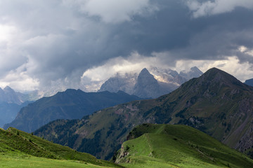 Fototapeta na wymiar Clouds over the mountains. Mountain alpine landscape. Dolomites, Italy