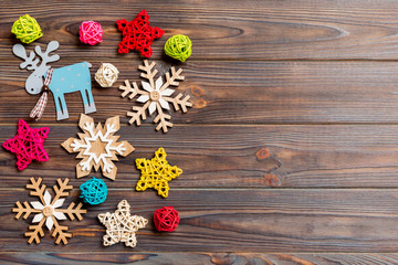 Top view of Christmas decorations and toys on wooden background. Copy space. Empty place for your design. New Year concept