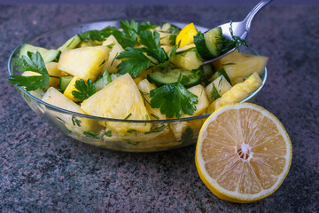 a plate of delicious summer lettuce from pineapple and cucumber closeup
