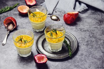 Fototapeta premium Passion fruit, rosemary and orange zest panna cotta