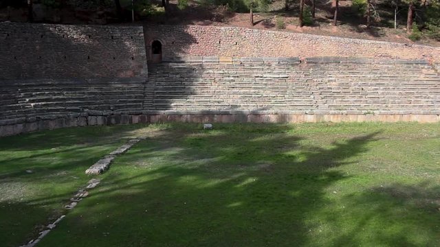 Wide, panoramic view of the Stadium of Delphi Sanctuary at the highest spot of the archaeological site in Phocis, Greece.