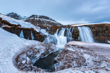 Famous mountain with waterfalls in Iceland, aurora borealis, night, kirkjufell, winter in Iceland, ice and snow, reflections, yellow grass, nature, icelandic famous landscape