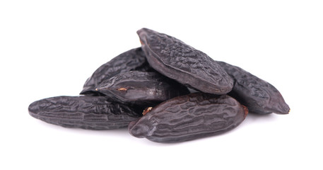 Tonka beans isolated on white background. Bean of Dipteryx odorata, cumaru or kumaru. Fresh aroma tonka beans.