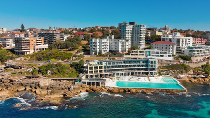 Fototapeta premium Amazing aerial view of Bondi Beach landscape in Sydney, Australia. Drone viewpoint on a sunny morning