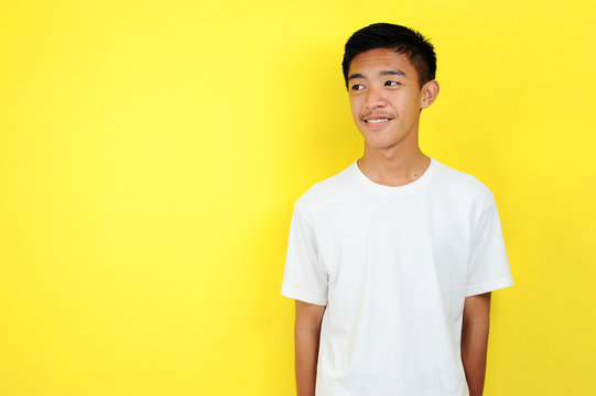 Happy of young Asian teenager smiling confident look at the copy space