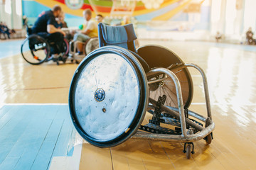 Modified wheelchair for play in rugby 