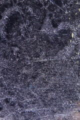 Black velvet fabric through drops of water on the glass. Bizarre patterns created by the refraction of light.