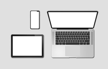 Laptop, tablet and phone set mockup isolated on grey. 3D render