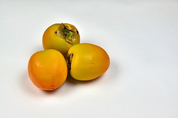 Fresh Persimmon Fruit on White Background
